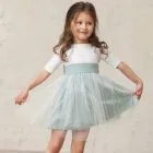 girl sash ceremony smooth green water