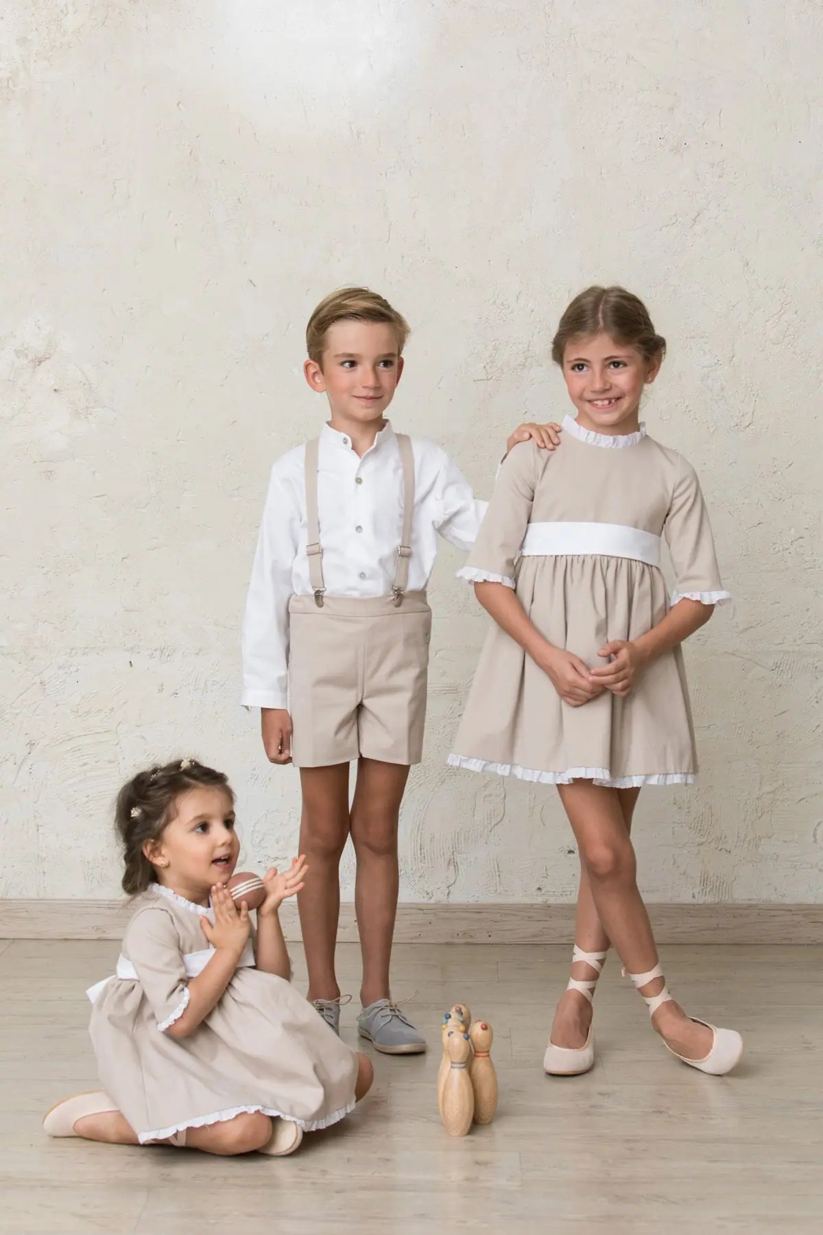 Bermuda shorts, trench coat, boy's winter ceremony