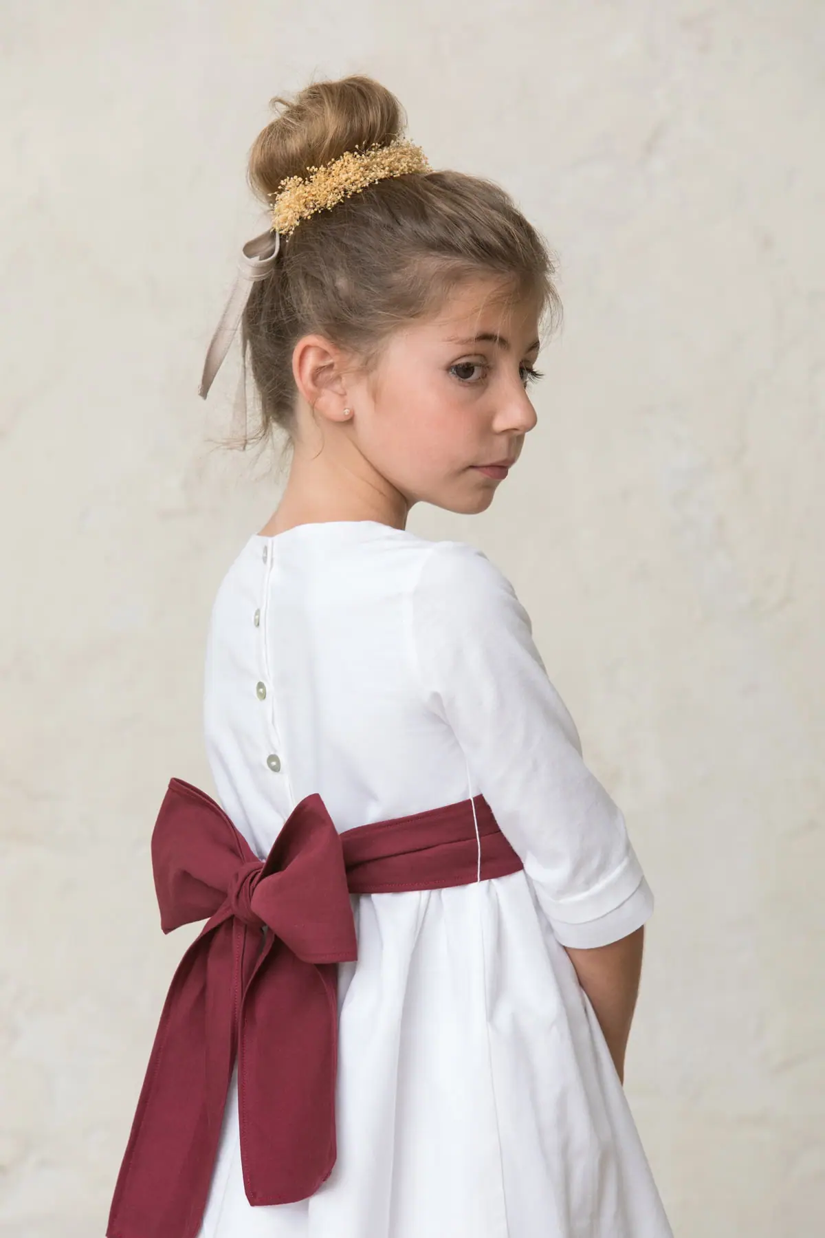 white dress for a girl's ceremony with laces