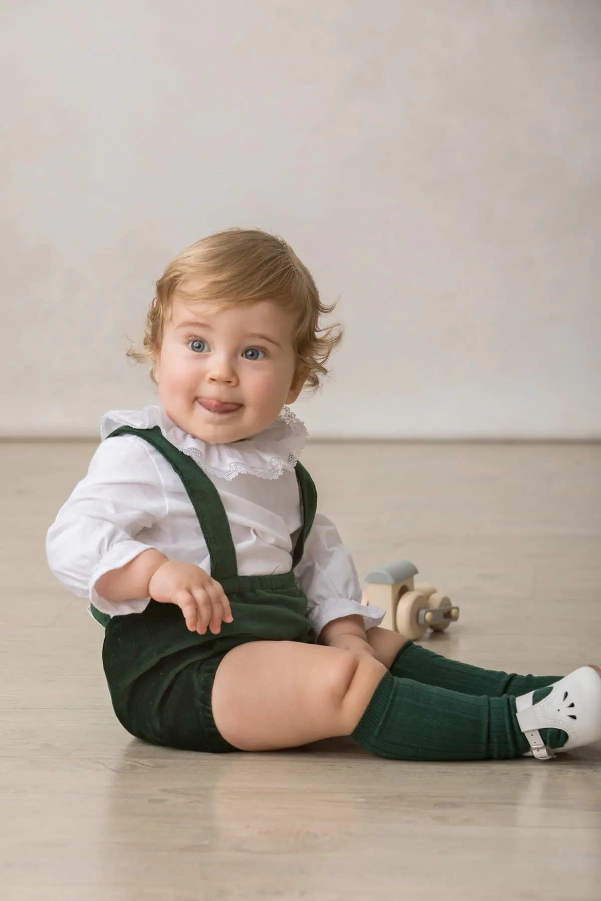 baby bloomers in bottle green velvet suspenders