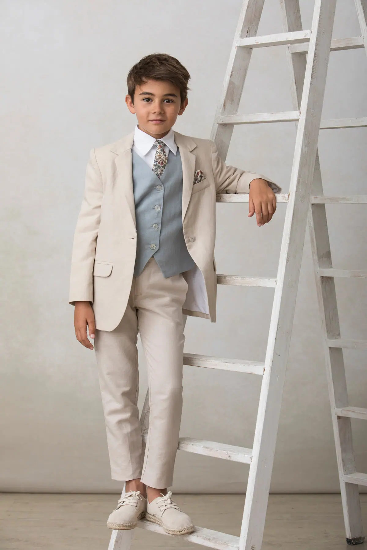 beige espadrilles for a boy's communion