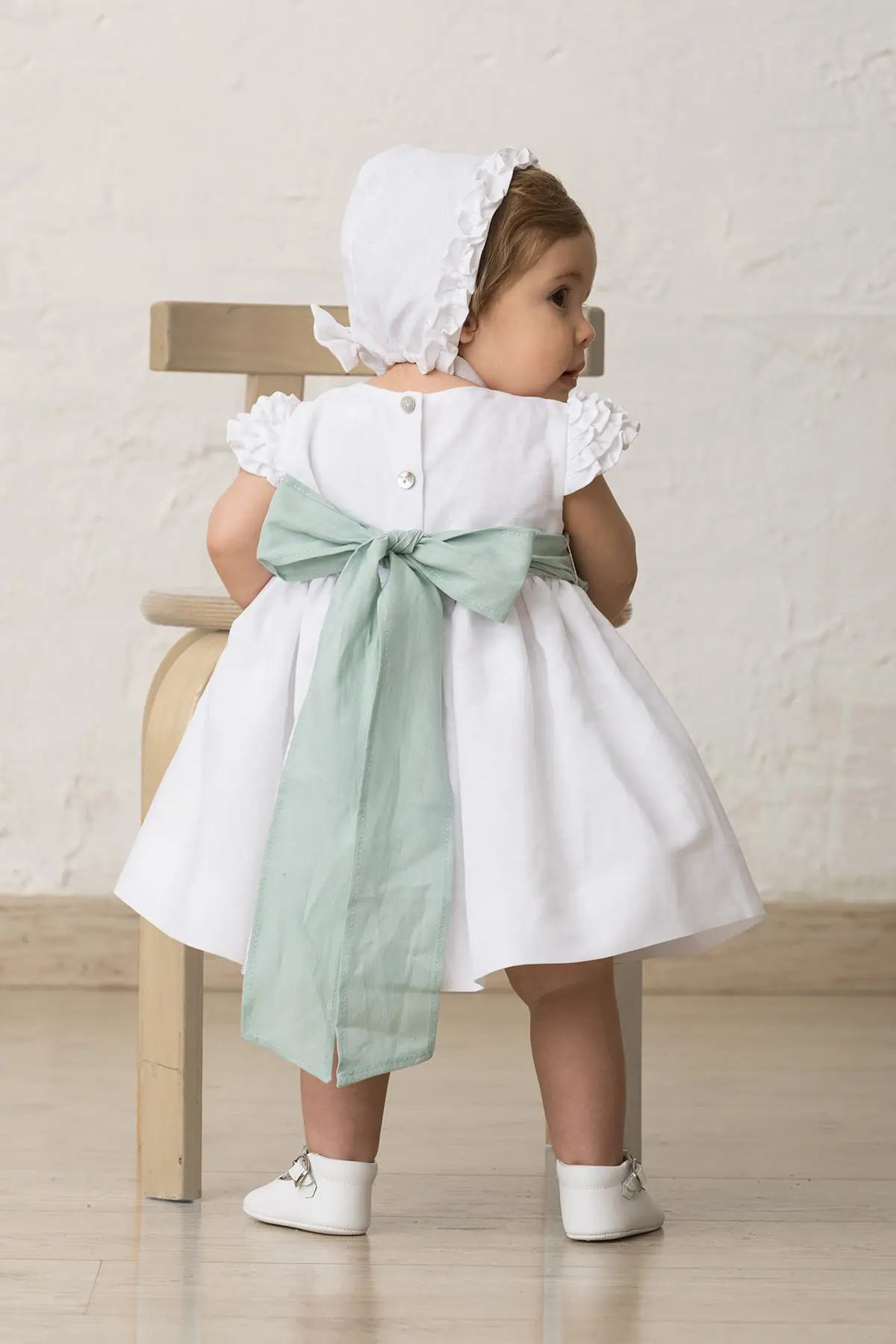 White ruffled baby dress | Qumono