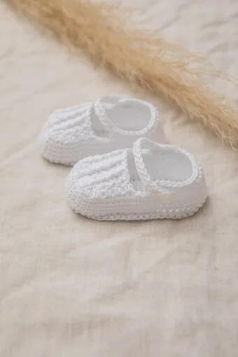 white knitted baby booties