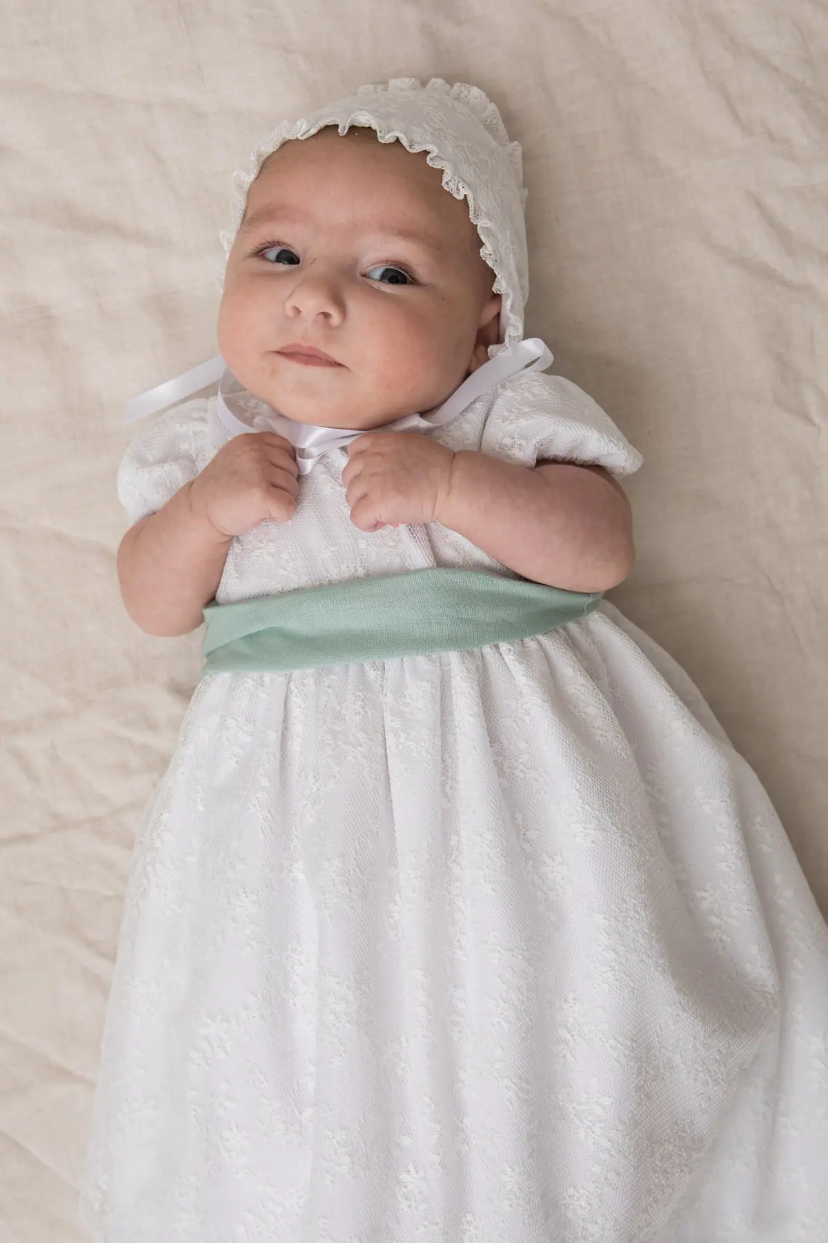 baptismal sash with aqua green bow