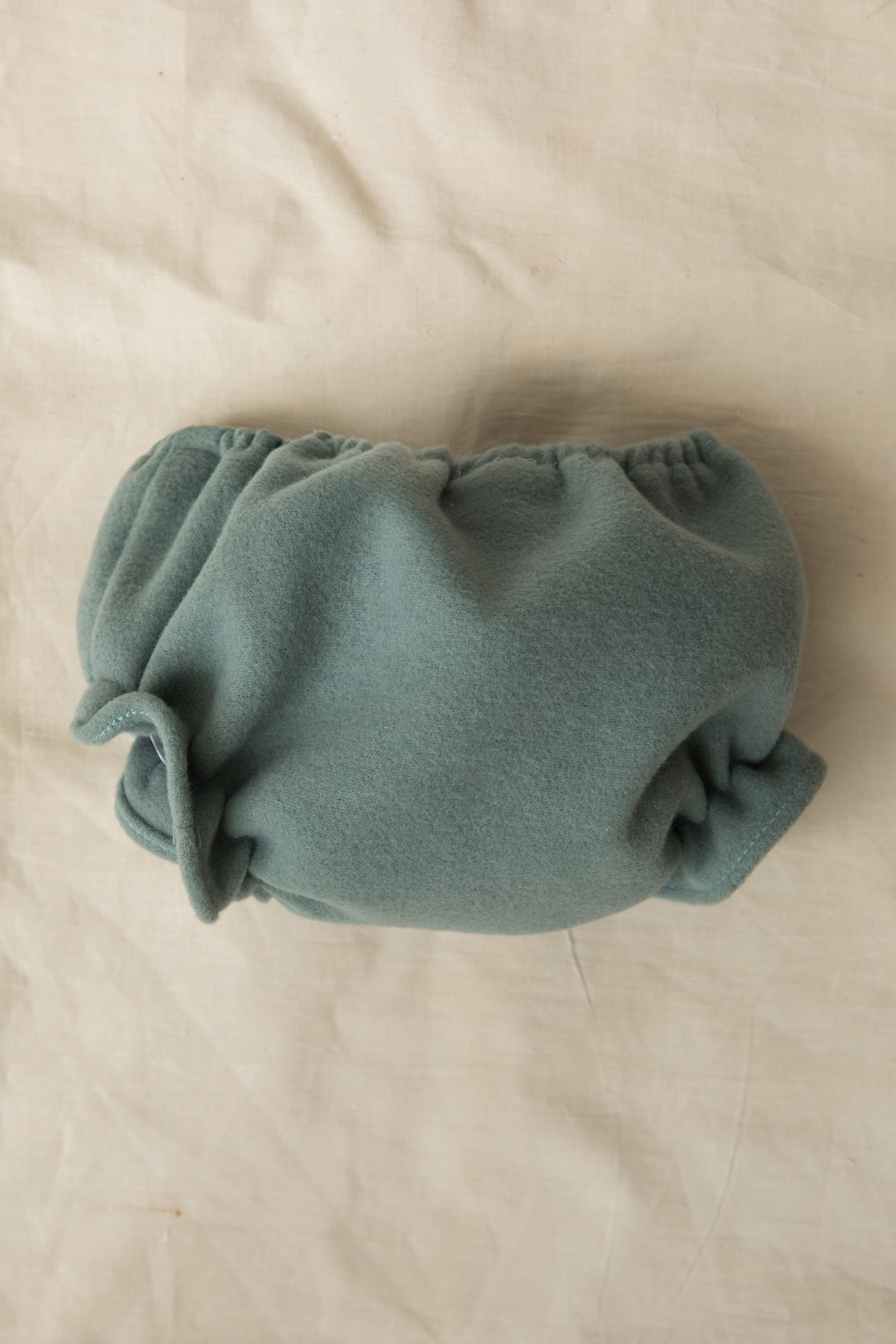 cubrepañal braguita de bebe en paño verde agua