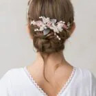 half crown of white and pink flowers for a girl's hair ceremony
