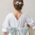 half crown of flowers for a girl's hair for a ceremony, white roses