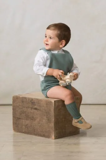 baby romper in green suspenders